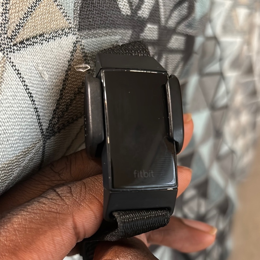 Fitbit Black Smartwatch with Sleek Design and Modern Clasp
